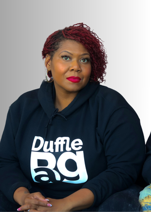 women wearing a #Black hoodie with 'Duffle BAG' text on a light gray background