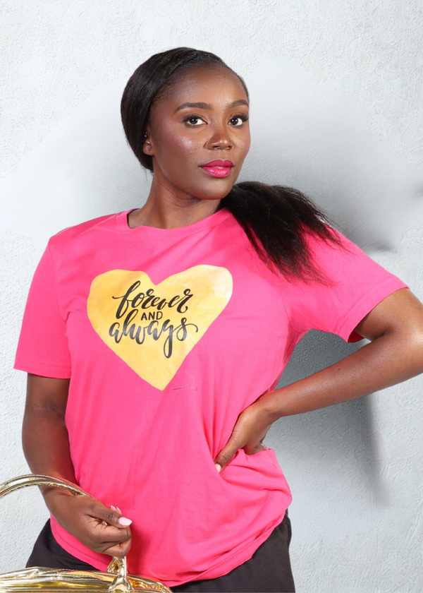 Woman wearing a #fuchia t-shirt with a yellow heart and text design on a plain background