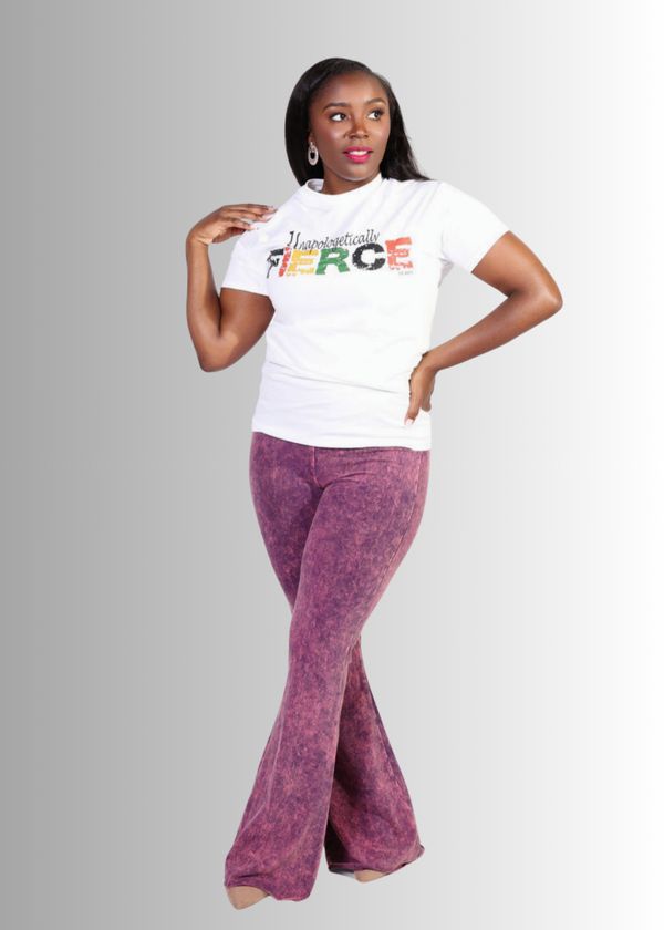 Unapologetically Fierce Tee worn by woman, featuring bold print and comfort fit.