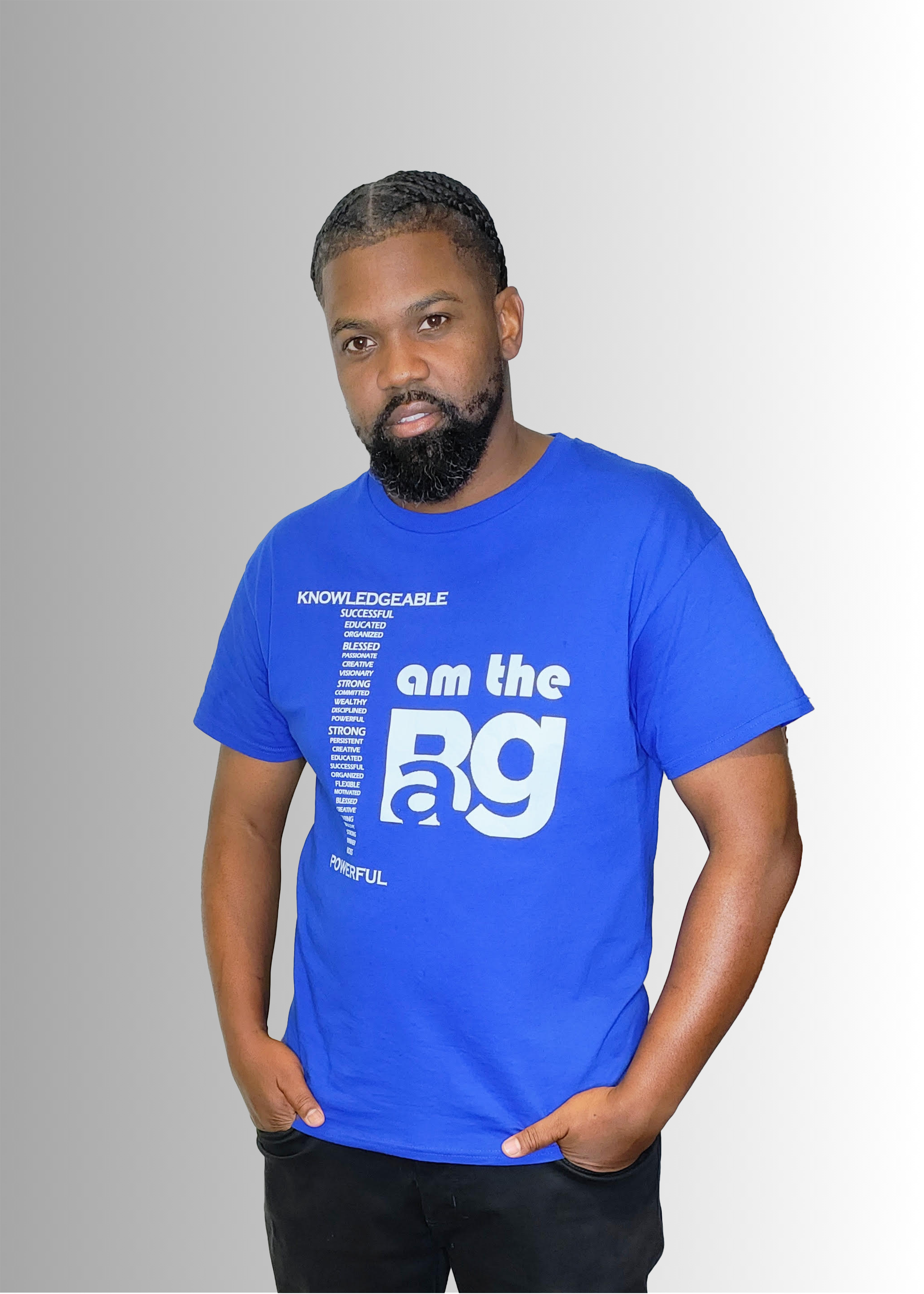Man wearing a blue I Am t-shirt by Duffle Bag apparel with white text on a gray background