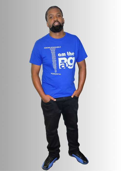 Royal blue unisex "I AM THE BAG" T-Shirt by Duffle Bag Apparel, featuring empowering text, worn by a model.
#blue/white