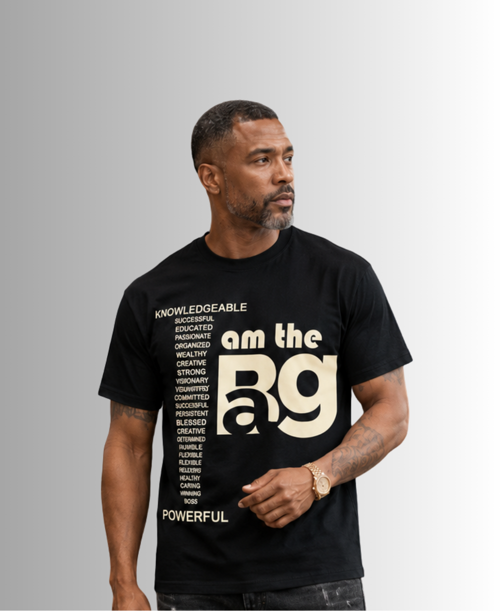 Man wearing a black t-shirt with cream I AM The Bag on it
