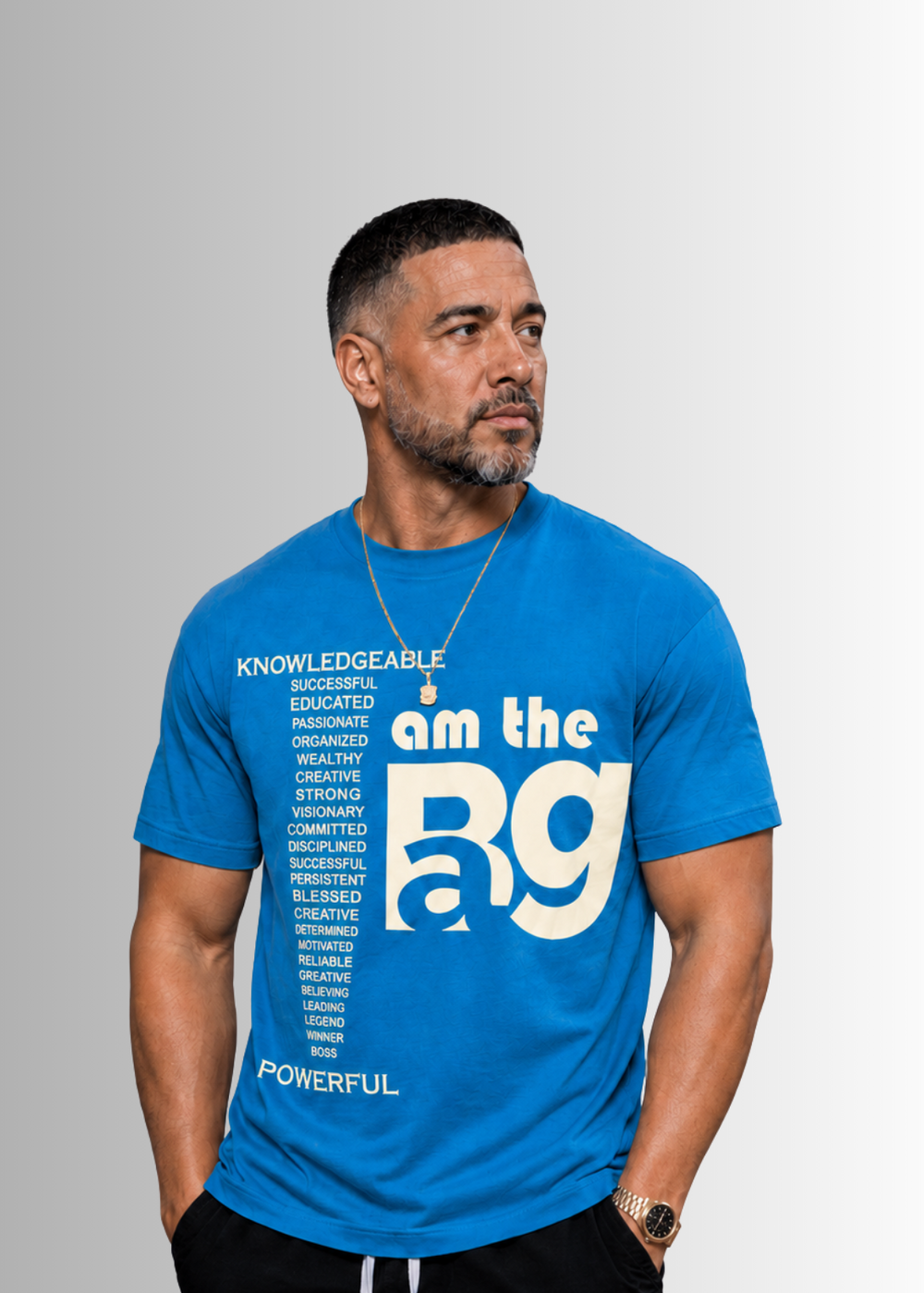 Man wearing a Teal t-shirt with Cream I AM The Bag on a gray background