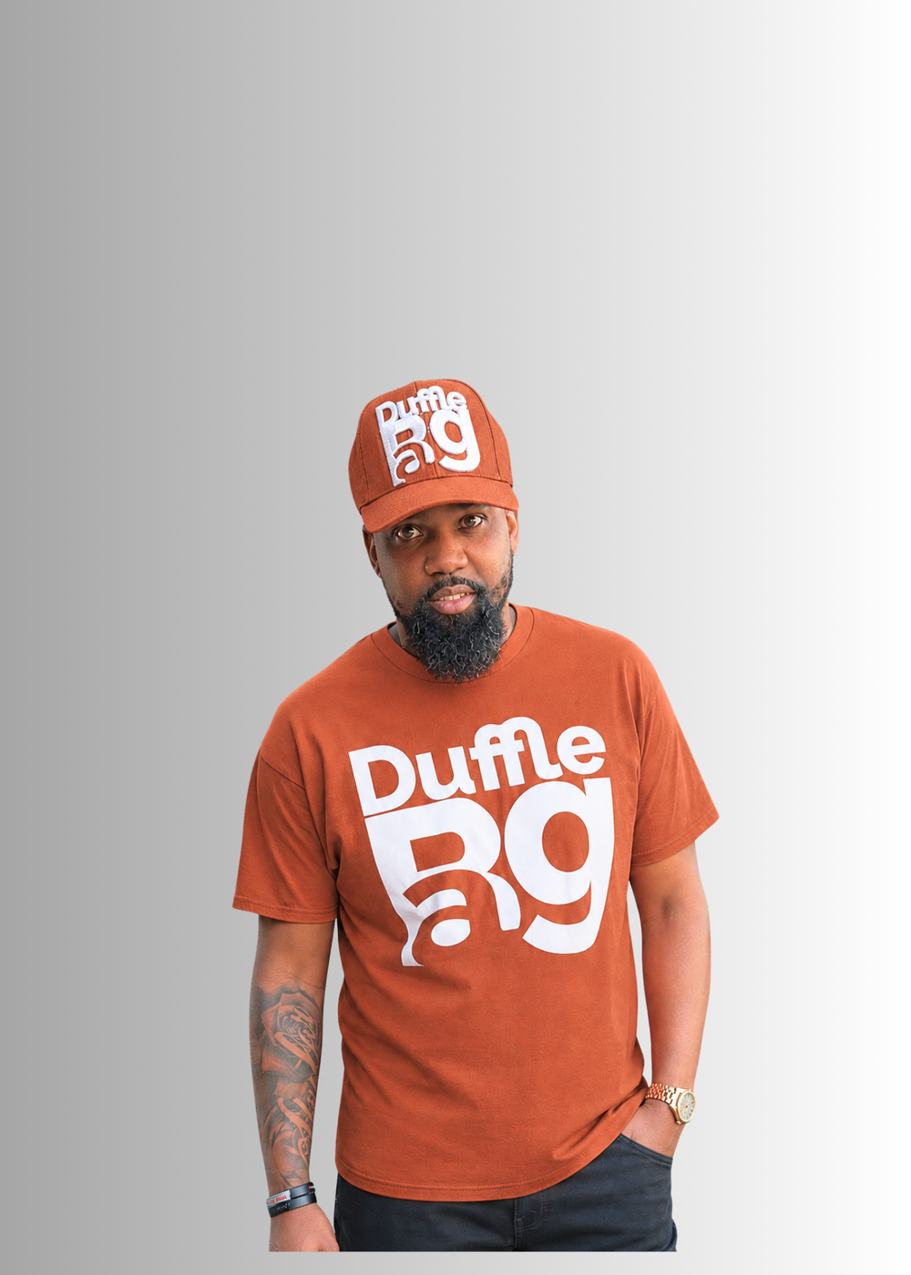 Person wearing a white t-shirt with 'Duffle BAG' text on a gray background