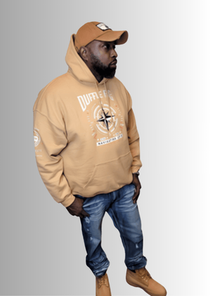 N.A.V Empowerment Hoodie by Duffle Bag showcased by a model wearing jeans and boots.
#Tan