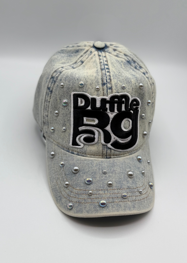 Pearl-studded light denim hat with Duffle Bag logo and distressed details.