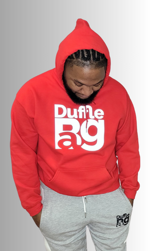 #Red men wearing a #red hoodie with large reflective letters reading 'Duffle Bag' in grey, paired with grey sweatpants.