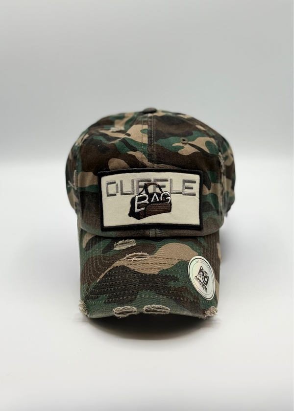 Camo Distressed Hat with rugged print and Duffle Bag logo.