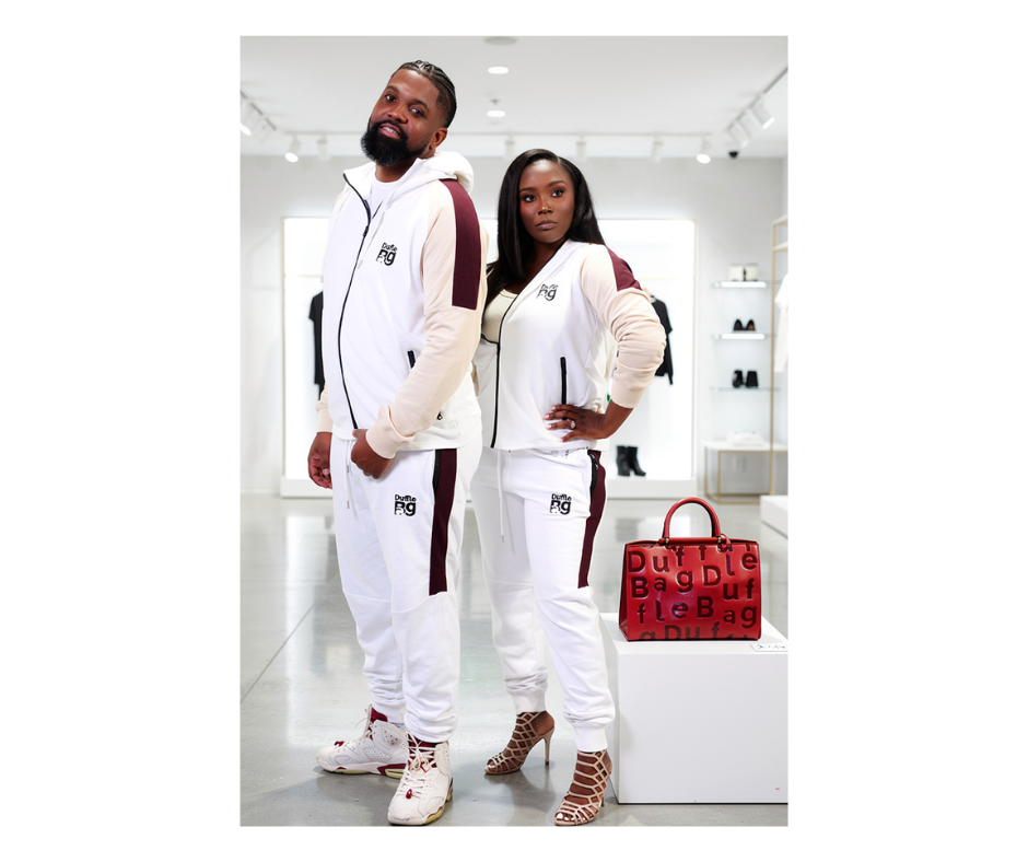 Two people in matching outfits with a red handbag in a store setting