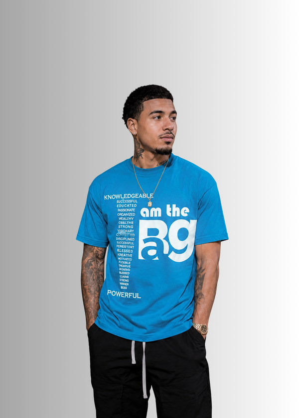 man  wearing a Teal blue I AM The Bag  t-shirt on a gray background