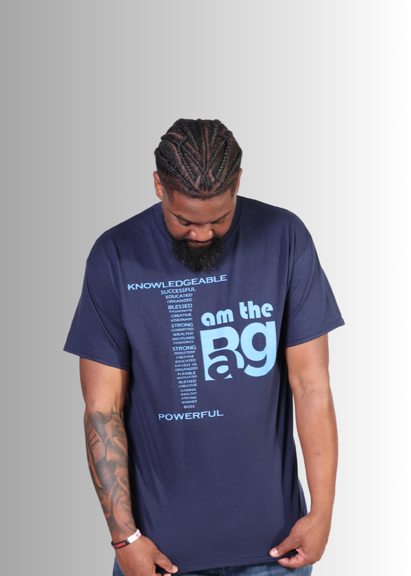 Man wearing a navy blue Duffle Bag I AM The Bag  t-shirt with motivational text on a gray background