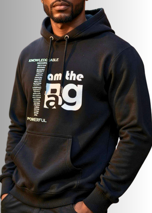 Person wearing a black Duffle Bag hoodie with Positive affirmations on a gray background