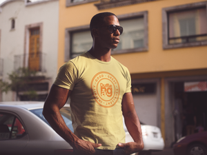 Unisex Glow In The Dark Tee with vibrant yellow and orange design, perfect for a sunny day.